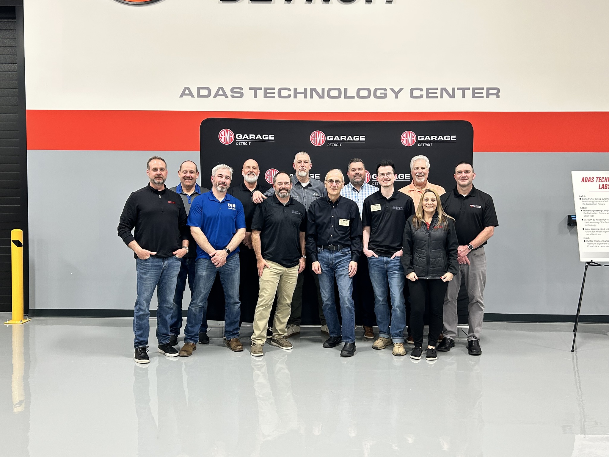 Make an Impact: Apply to Join the WTSBC Select Committee! - Image of WTSBC members in the SEMA Detroit garage.