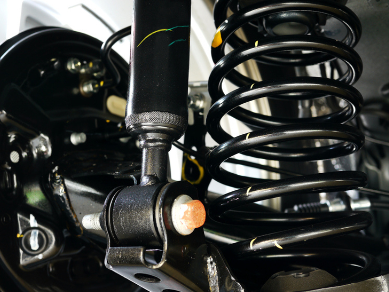 image of shock and spring behind a brake hub