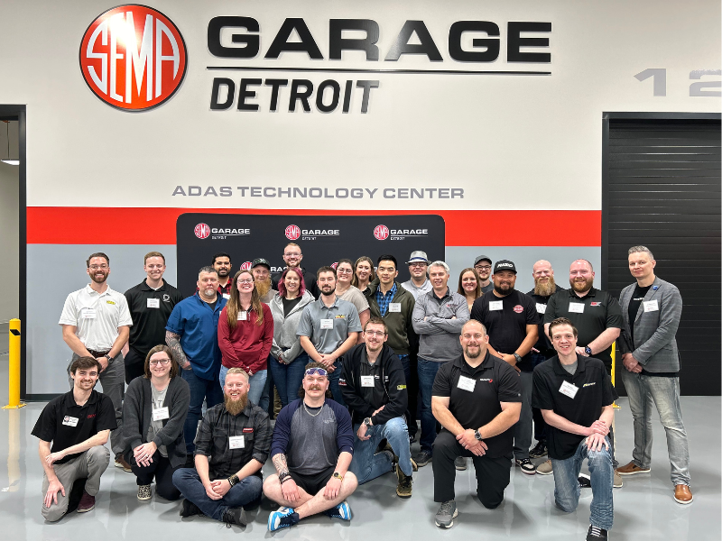 Group photo of FLN members at the SEMA Detroit Garage