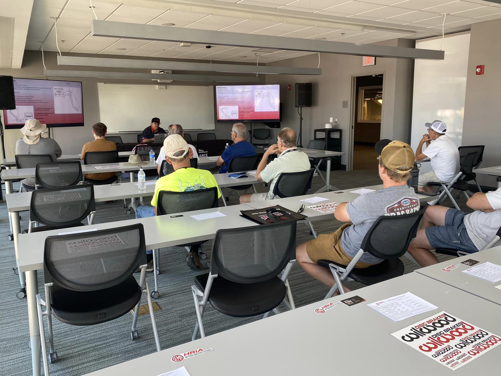 People sitting and watching a presentation