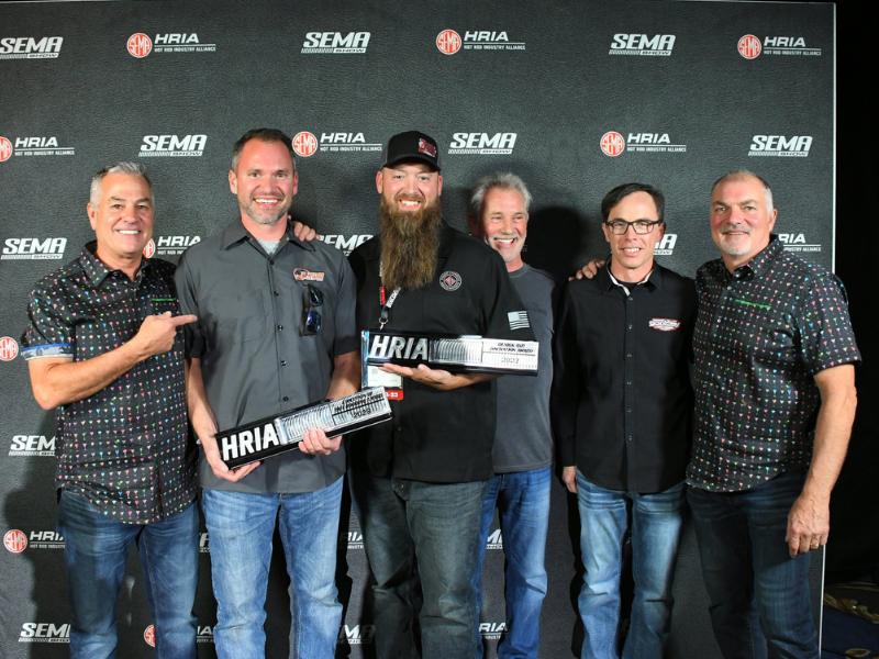 Group of guys showing iff their awards