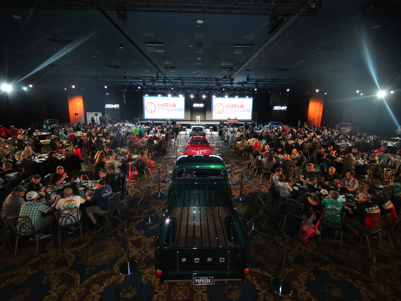 HRIA Reception - people seated at dinner tables watching presentation