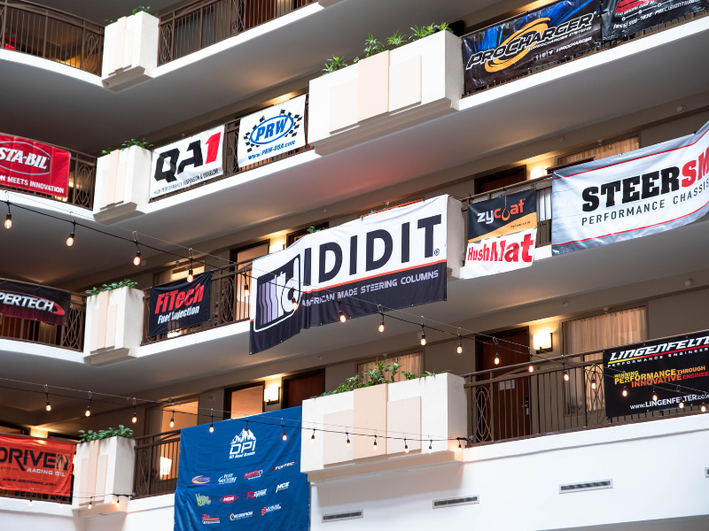 Manufacturers banners hanging from balconies inside the hotel during the Media Trade Conference