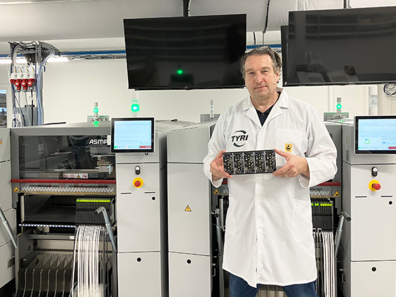 TYRI’s Circuit Board Production Facility  - man holding circuit board in lab setting