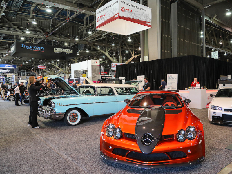 Cars on display at the SEMA Show HRIA booth.