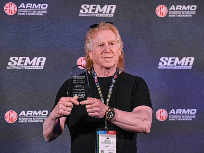 Jeff Leonard posing with his person of the year award.