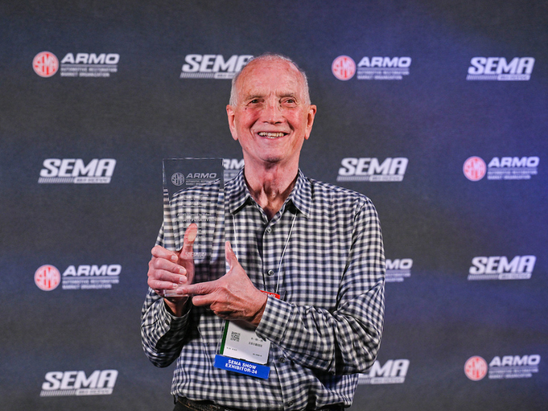 Dwight Forrister posing with his Hall of Fame Award