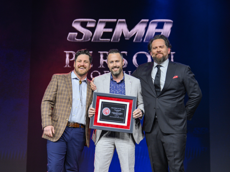 PRO Chair Colby McLaughlin holding SEMA Person of the Year award